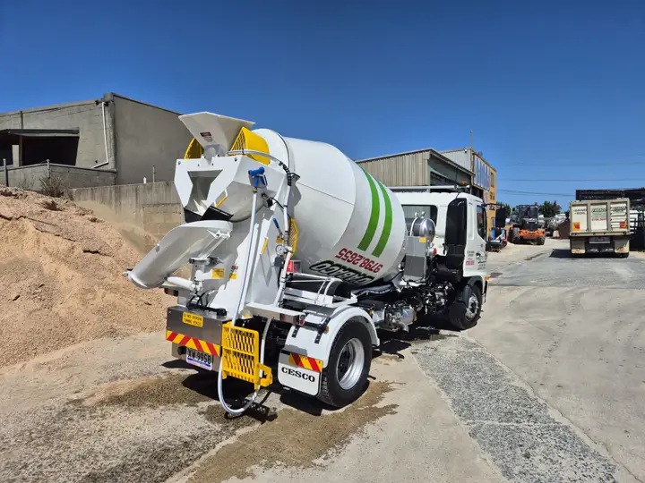 Rear view of D'Abaco Mini Mix concrete truck and chute